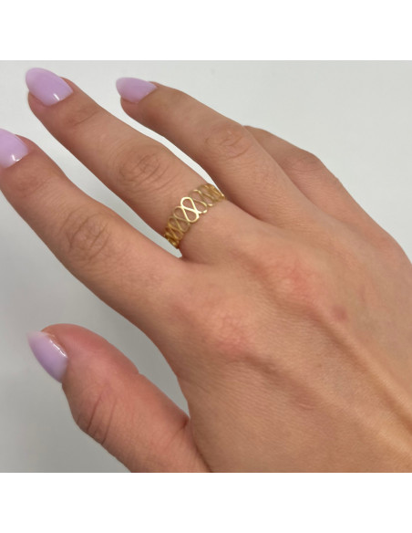 ANILLO EN ORO CON FORMA DE ONDAS CALADAS