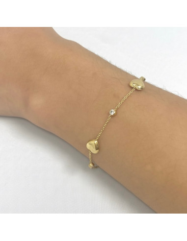 PULSERA EN ORO CON CORAZONES Y CIRCONITAS