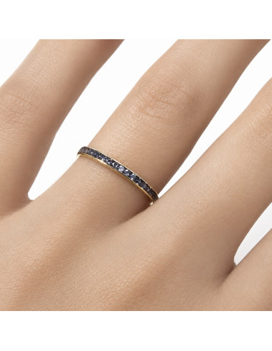 ANILLO EN ORO AMARILLO DE 9 QUILATES CON CIRCONITAS AZULES EN CARRIL FINO