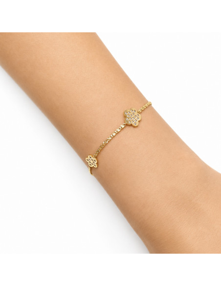 PULSERA EN ORO AMARILLO DE 18 QUILATES MALLA ANCLA TRES FLORES CIRCONITAS