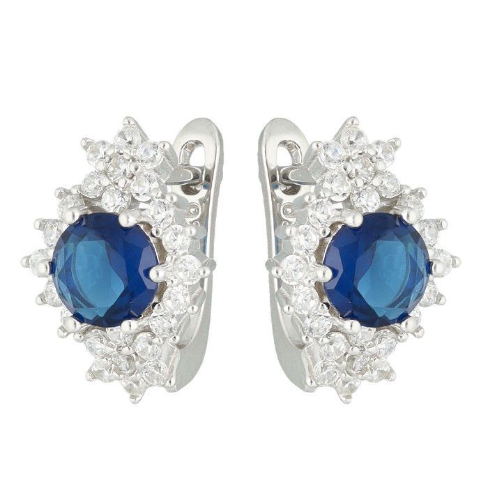 PENDIENTES EN PLATA CON CIRCONITAS BLANCAS CENTRO AZUL FLORES PICO
