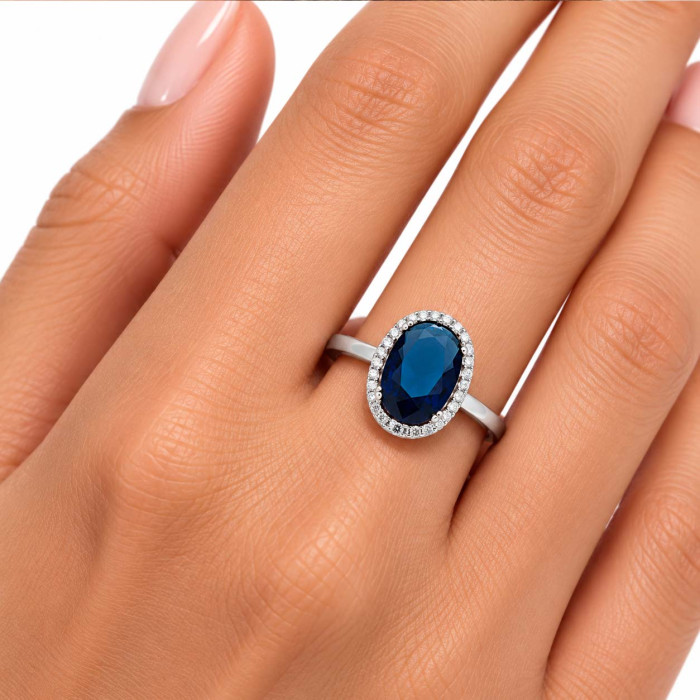 ANILLO EN PLATA CON CIRCONITAS Y CENTRO AZUL OVAL 2